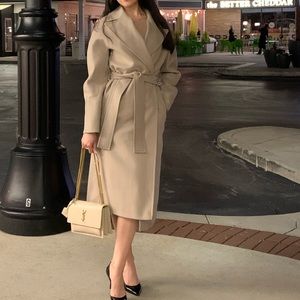 Malibuelite Instagram brand. 60 % Wool, viscose, and silk blend coat.